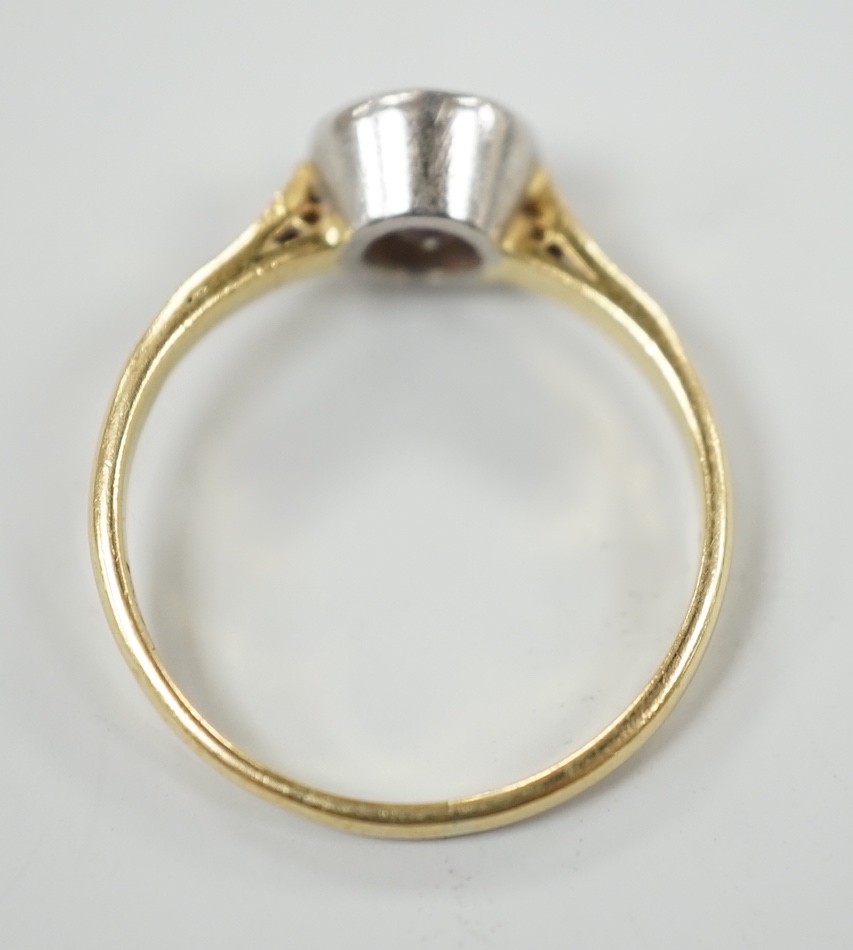 A modern 18ct gold and collet set solitaire diamond ring, size N, gross weight 3.1 grams, the stone diameter approx. 6.1mm